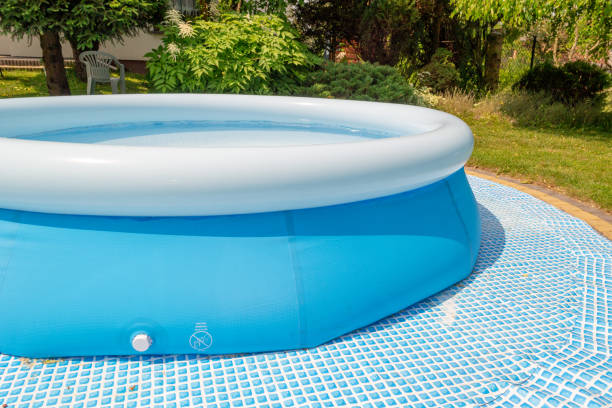 istock A round, blue, garden pool for children. 1156935155