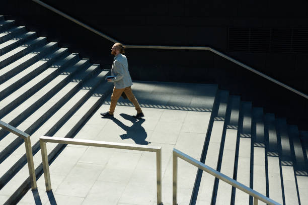 istock Young male manager rushing for meeting 1156935942