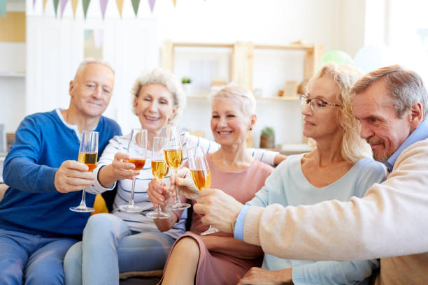 istock Happy friends clinking flutes 1156937199