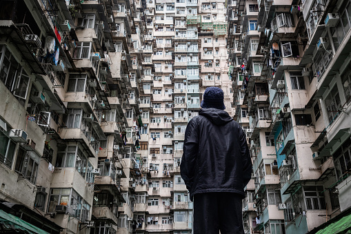 Traveler exploring the urban landscape of Hong Kong, China, one of the most densely populated cities in the world.