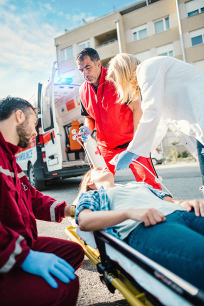 istock Doctor and paramedics helping woman 1156938416