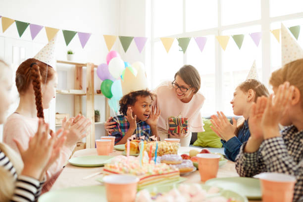 istock Excited Boy at Birthday Party 1156938918