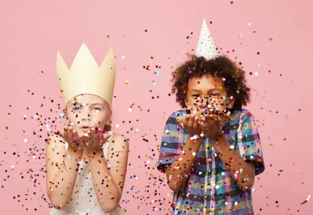 Photo of Kids Blowing Glitter