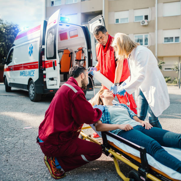 istock Doctor and paramedics helping woman 1156940140