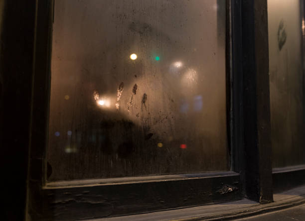 Handprint On Smoked Pub Window Glass