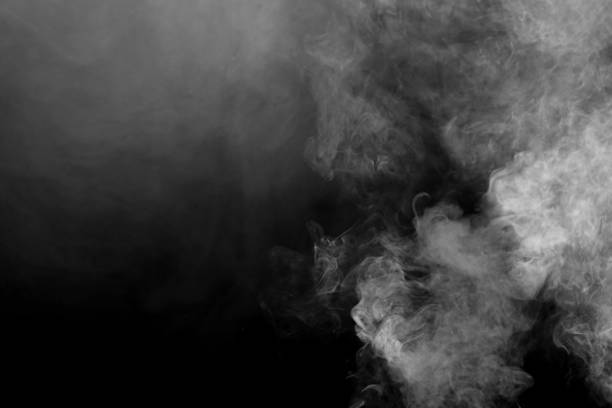 暗い背景に白い煙が吹く。 - smoke condensation fumes isolated ストックフォトと画像