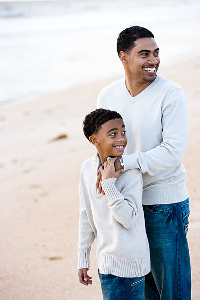 istock African-American father and son on beach 115694414