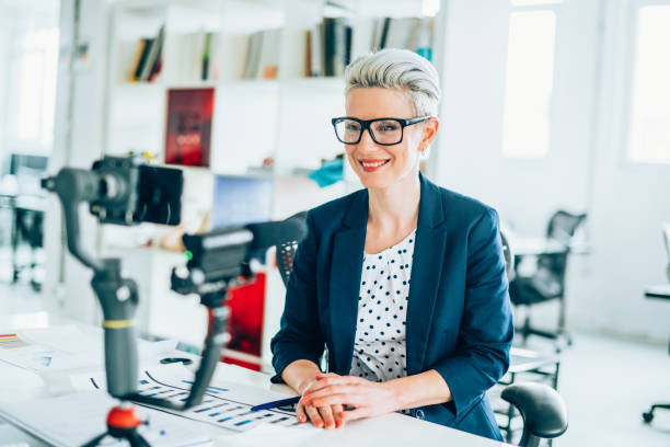 istock Businesswoman vlogging at the office 1156945362
