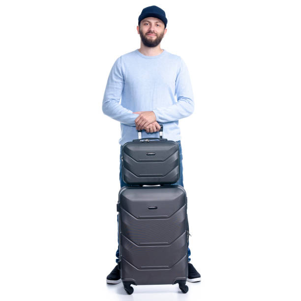 istock Man in jeans with travel suitcase standing 1156945445