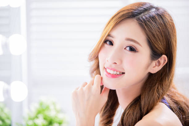istock woman smile to you 1156945924