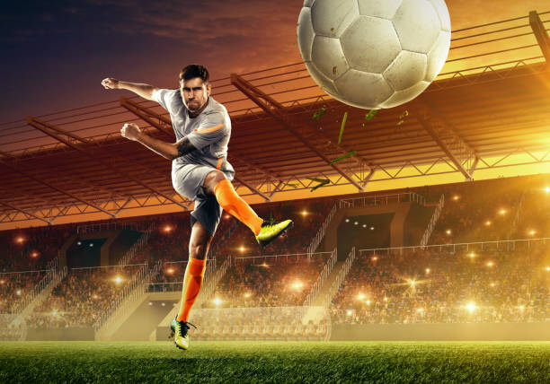 istock Soccer player on a stadium with a ball 1156948768