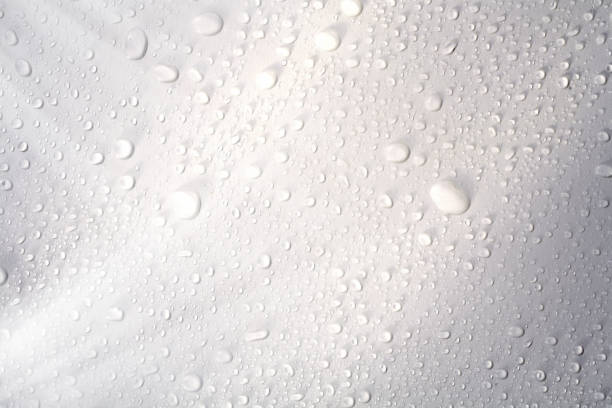 istock close up abstract water droplets on shiny surface 1156952548