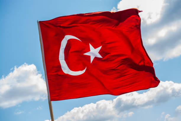 istock Turkish national flag with white star and moon in sky 1156953887