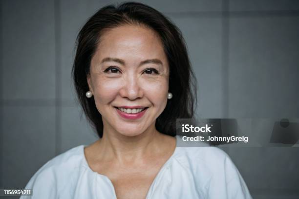 Attractive Senior Chinese Woman Smiling Stock Photo - Download Image Now - Women, Asian and Indian Ethnicities, One Woman Only