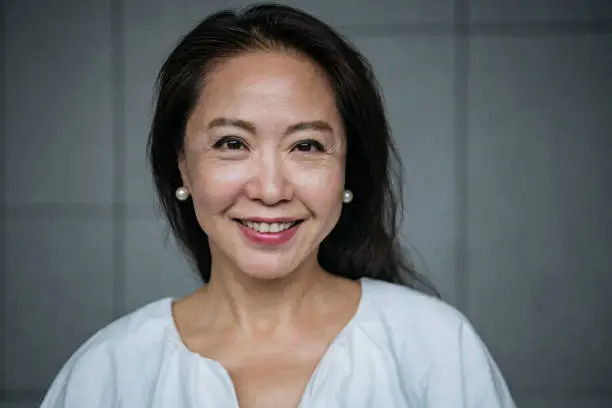 Photo of Attractive senior Chinese woman smiling