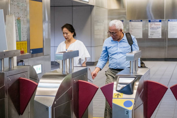 istock Senior couple at subway station ticket barrier 1156954232