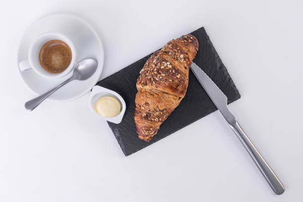 istock a golden croissant with sesame seeds 1156955930