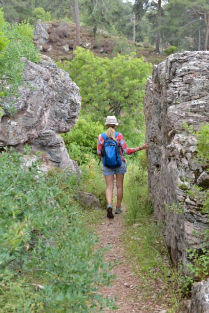 istock Woman walking in nature. 1156964649