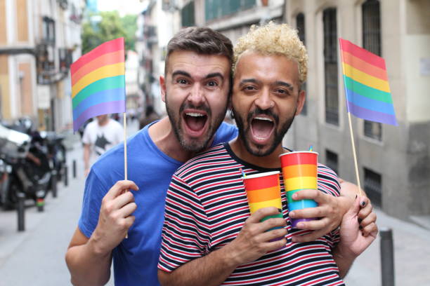 istock Ecstatic gay couple screaming in happiness 1156964840