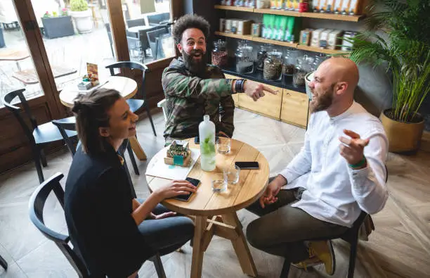 Friends having a meeting at a local cafe.