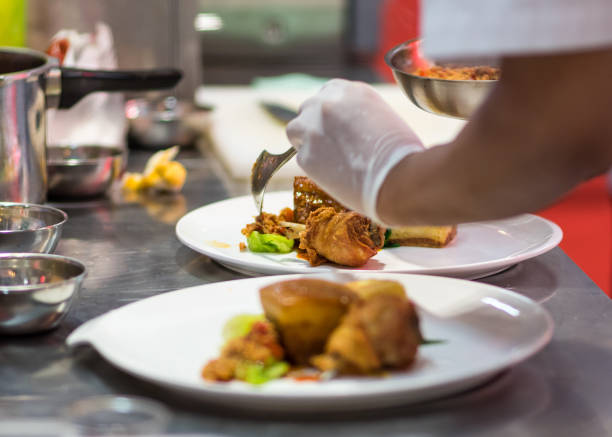 istock Chef preparing food in the kitchen, chef cooking 1156965080