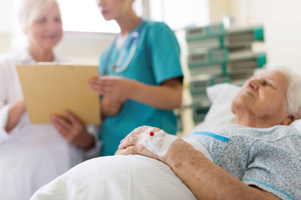 istock Senior patient in hospital bed 1156968202
