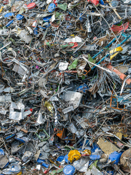 istock Recycling: Pile of mixed  metal scrap, waste garbage at junkyard 1156969712