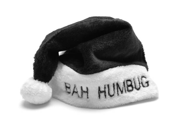 A red soft Christmas hat lying on a black background