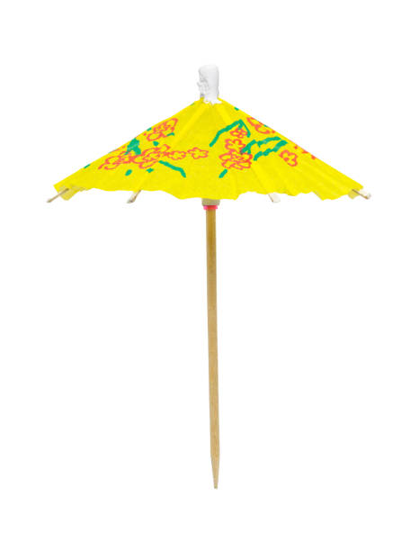 istock Yellow Cocktail Umbrella Cut Out 1156975213