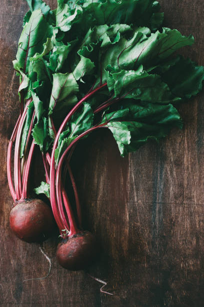 istock Beetroot on dark wooden background 1156975623