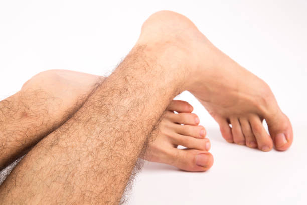 istock men foots white background and isolated 1156975794