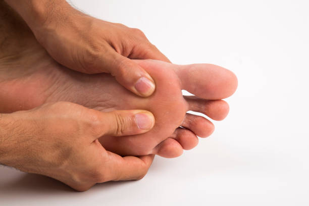 istock foot massage on white and isolated background 1156975883
