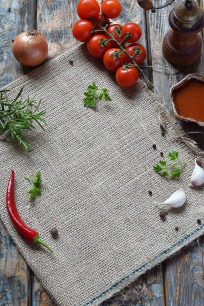istock Rustic composition with pepper mill, tomato souce, fresh herbs, vegetables and spices. Country style. Baking or cooking background. Copy space for text, menu, recipes. 1156975906