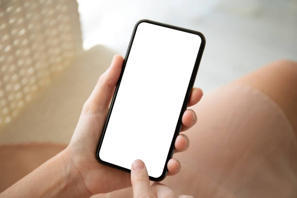 istock female hands holding phone with isolated screen 1156976728