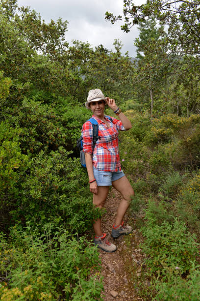 istock Woman walking in nature. 1156977106