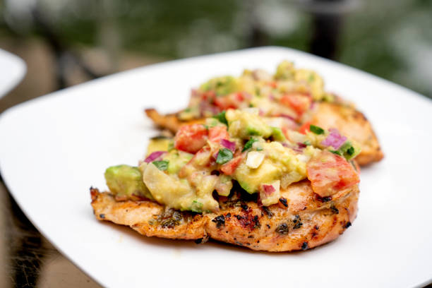 istock Grilled Cilantro Lime Chicken Topped With Fresh Avocado Salsa 1156979370