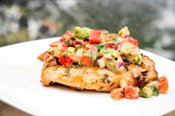 istock Grilled Cilantro Lime Chicken Topped With Fresh Avocado Salsa 1156979438