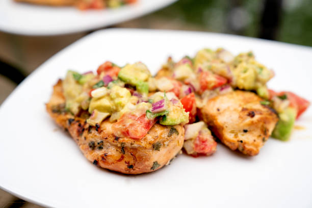 istock Grilled Cilantro Lime Chicken Topped With Fresh Avocado Salsa 1156979441