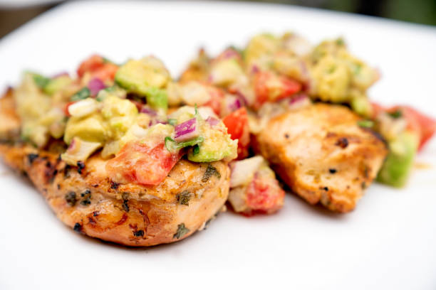 istock Grilled Cilantro Lime Chicken Topped With Fresh Avocado Salsa 1156979442