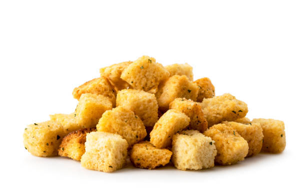 istock Heap crispy bread crackers close-up on a white. Isolated. 1156980695