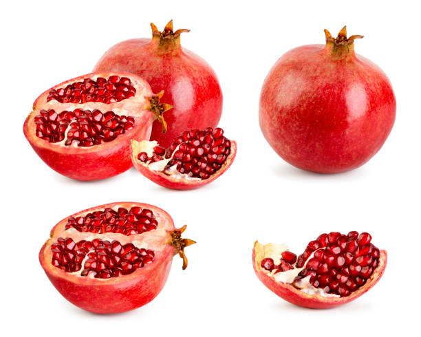 istock Set of ripe pomegranate, half and piece on a white background. 1156980982