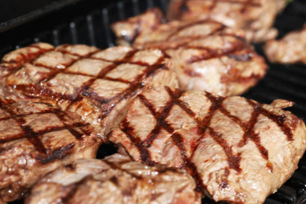 istock Steak on the grill with a lozenge pattern 1156981286