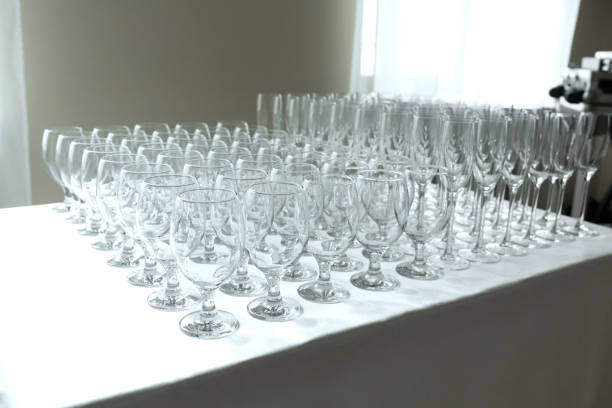 Many empty clean glasses for guests at the buffet festive wedding table.