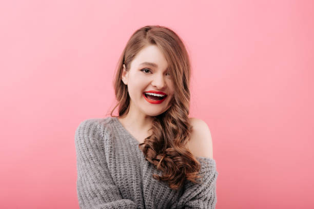 istock Stylish woman laughing and looking at camera 1156988485