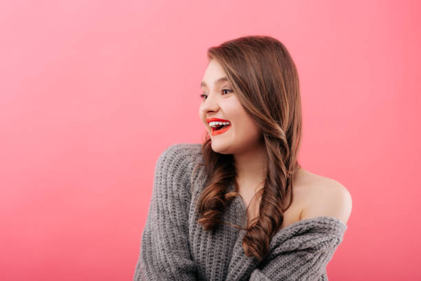 istock Attractive smiling woman in sweater 1156988493
