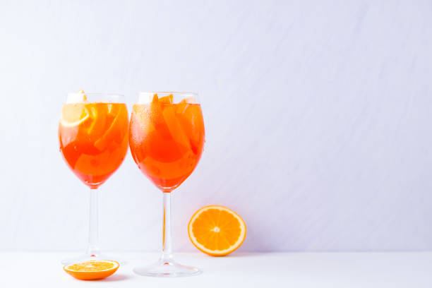Cocktail Spritz with mint leaves on a white background. Italian cocktail Spritz on white background