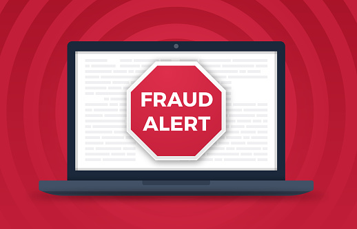 Fraud alert digital laptop computer crime warning.