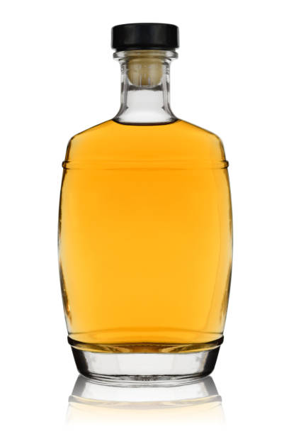 istock Unopened bottle of brandy with reflection on a white background 1156990077