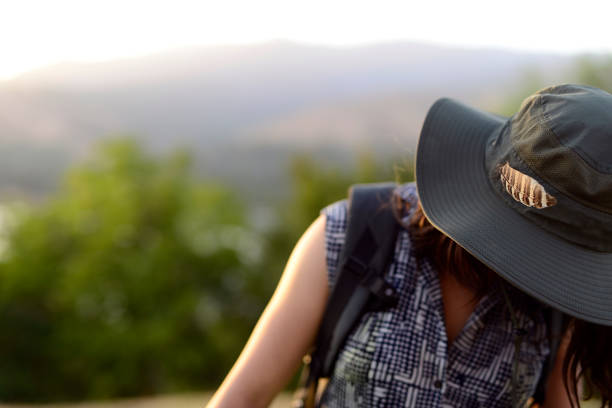 istock Traveller girl with an owl feather on her hat 1156992122
