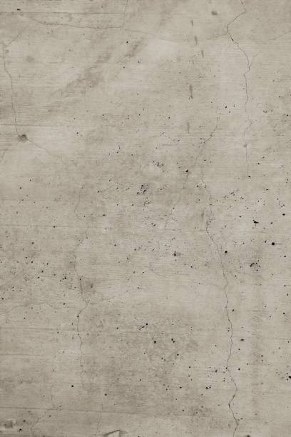 istock Light brown concrete wall background structure with small holes cracked and ground structural effect. Matte marble design. 1156992263